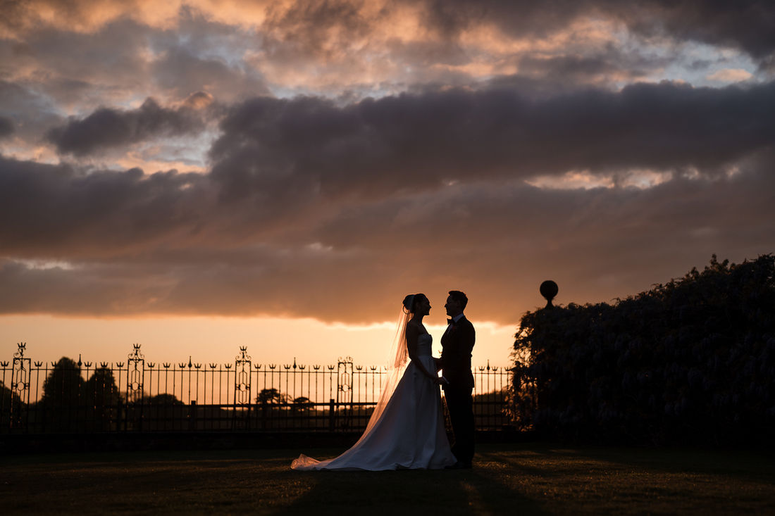 Silhouette of a couple against a dramatic evening sky