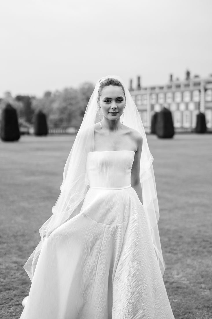 Black and white portrait of a bride in the grounds of a country estate